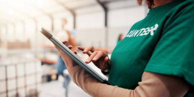Volunteer using a tablet.