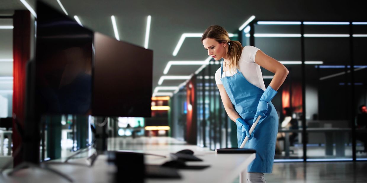 Woman cleaning office setting