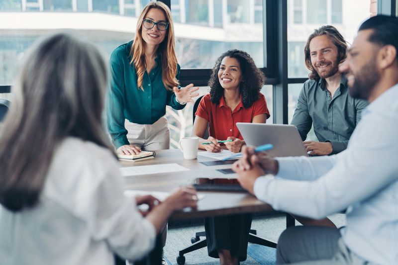 Group of business persons talking in the office