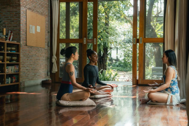 Two female friends practicing meditation at a wellness resort. In this serene setting, they embark on a journey of self-improvement, letting go of stress and embracing a sense of clarity and balance, nurturing both their minds and spirits