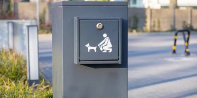 Dog waste disposal station outdoors.