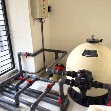 pool filtration system in pump room with side mount sand filter