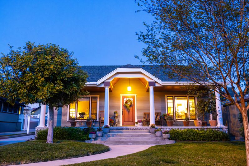A 1923 Craftsman Bungalow Home with a fresh coat of paint in twilight