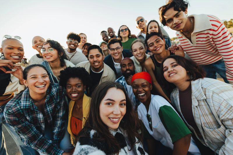 A large and diverse group of individuals expresses solidarity and unity through togetherness and advocacy. Hundreds of people taking a stand against hate.
