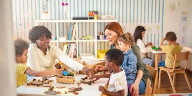 Children and teachers engaging in playful learning activities at a preschool.