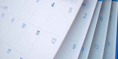 Close-up of a calendar showing days and dates.