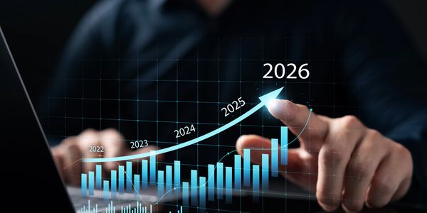 Hand pointing to a rising graph with years 2022 to 2026 showing growth.
