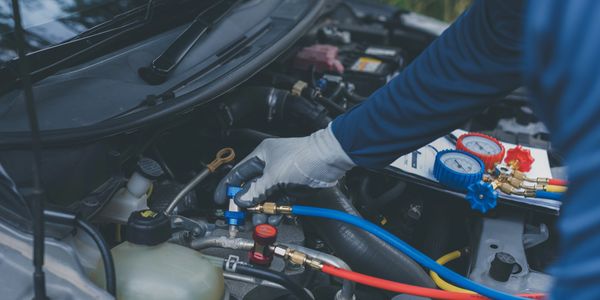 ASE-certified technician performing auto A/C diagnostic in Indian Harbour Beach at Harbour Automotiv