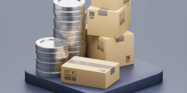 Stacks of silver coins and cardboard boxes on a dark platform.