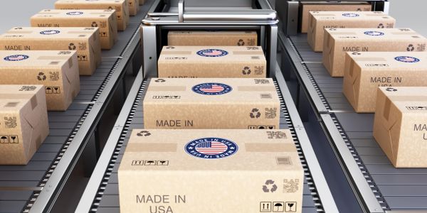 Packages labeled "Made in USA" on a conveyor belt.