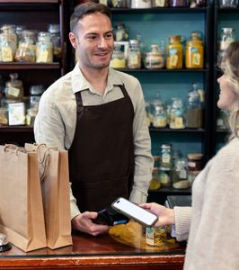 Smiling elderly couple enjoying a healthy pasta salad meal together at home.