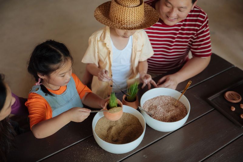Family volunteers joyfully planting a young tree for a greener environment