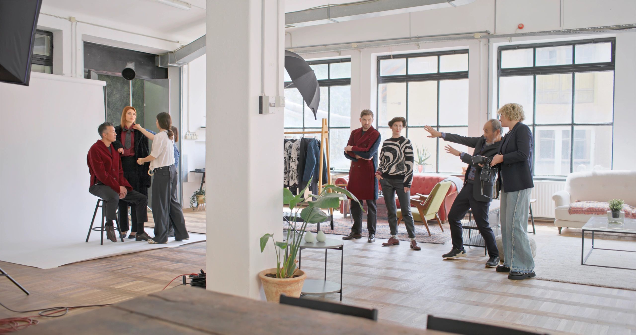 clients and crew discussing a photoshoot in location