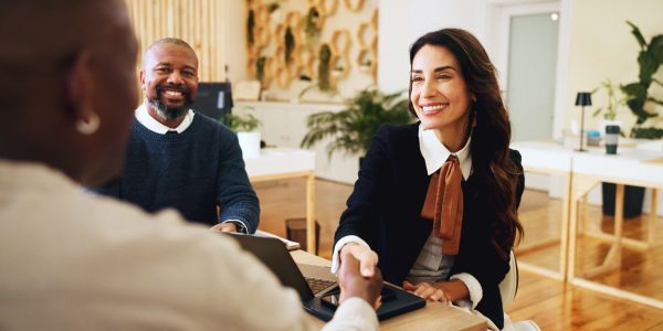 Business handshake in a modern office.