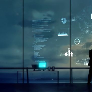 Silhouette of a person with futuristic data visuals on glass wall in a dark office.