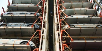 Vertical automated parking rack system storing multiple vehicles in a compact footprint