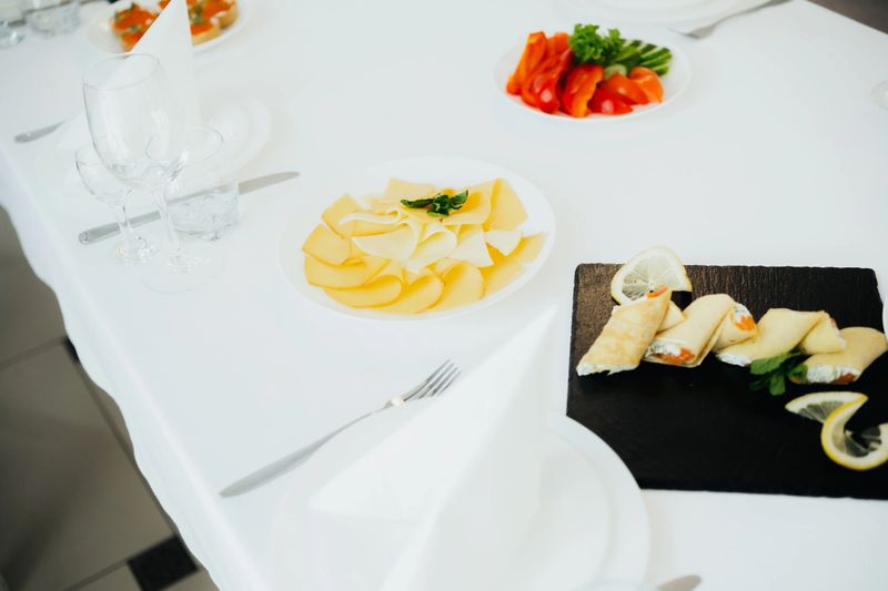 A beautifully arranged table showcases colorful dishes and fresh appetizers.