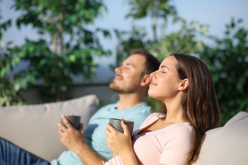 Couple relaxing and drinking coffee in a terrace a sunny day