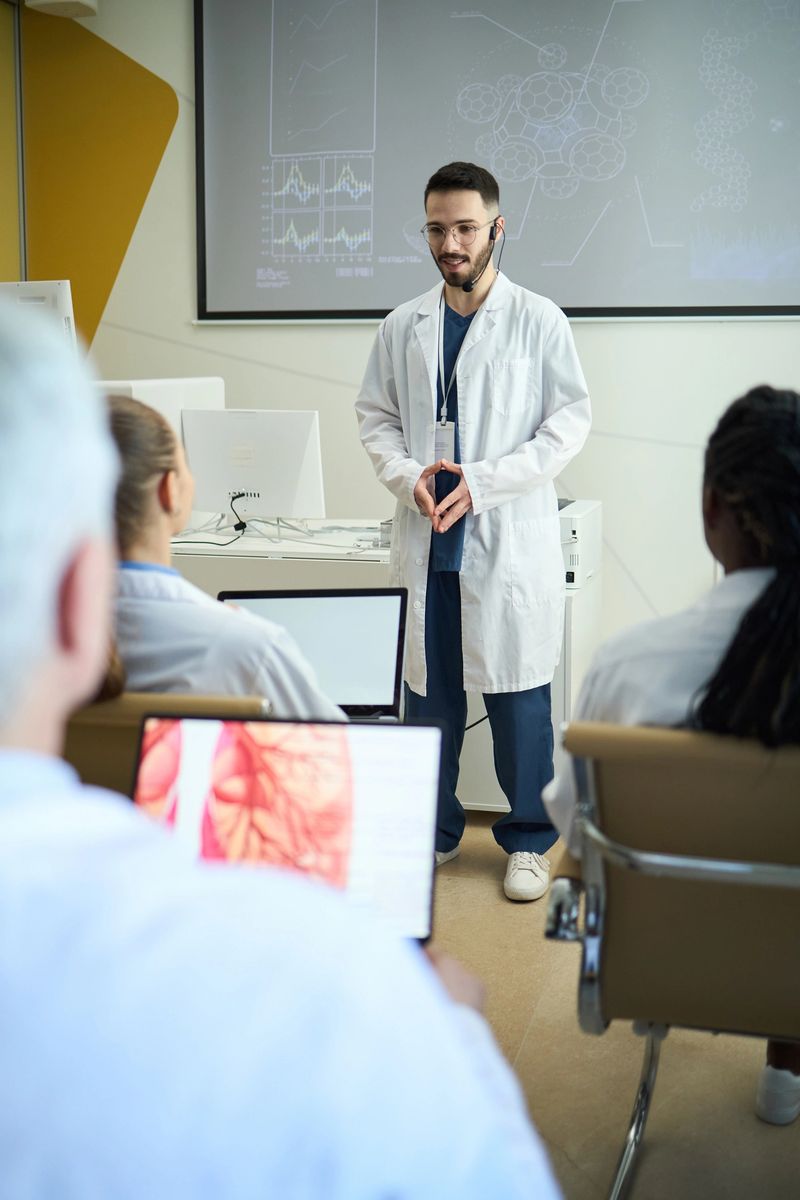 Educating a group of diverse students in modern laboratory room with presentation screens and laboratory equipment in background, engaging students with hands-on demonstration
