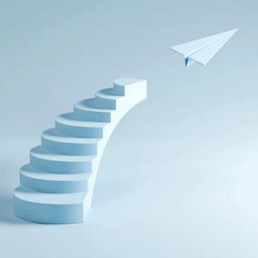 Curved staircase leading to a flying paper airplane in a minimalistic setting.
