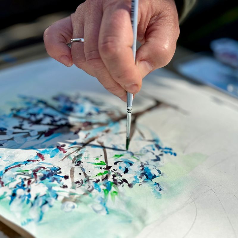 Artist painting a Tree with Watercolors