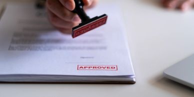 Document stamped with 'APPROVED' in red ink.