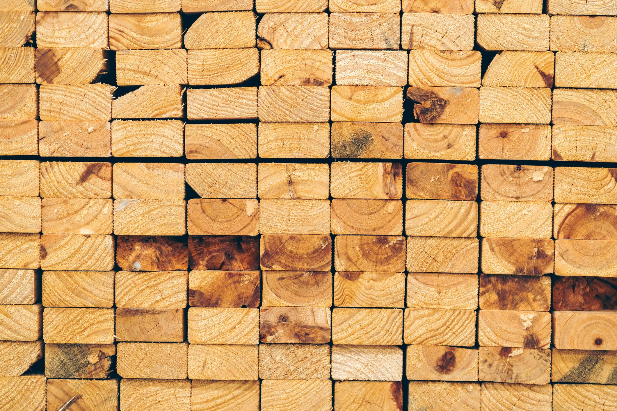 Stacked lumber ready for construction, furniture, packaging, and industrial applications.
