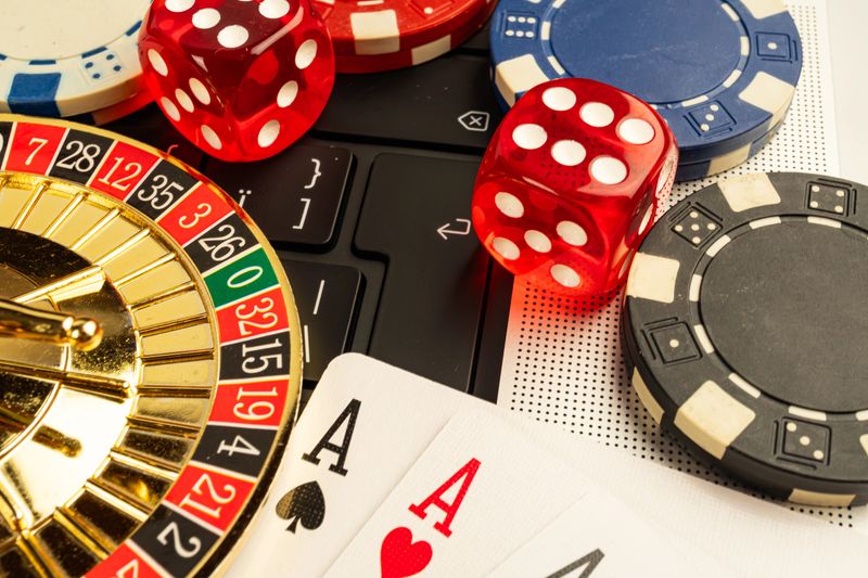 Action-packed casino gaming scene, with vibrant red dice and cards on a roulette table Fast-paced environment, suggesting poker, blackjack, or roulette games Blurred background conveying movement,