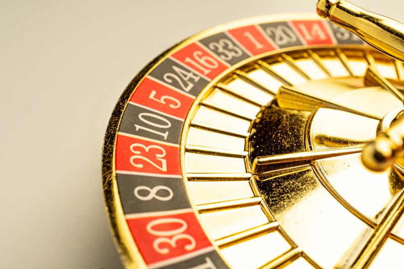 Close-up of spinning gold roulette wheel, suggesting suspense or potential fortune Represents themes like chance, gambling, luck, luxury, and games of chance