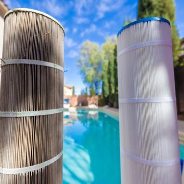 Comparison of a dirty and a clean pool filter by a backyard pool.