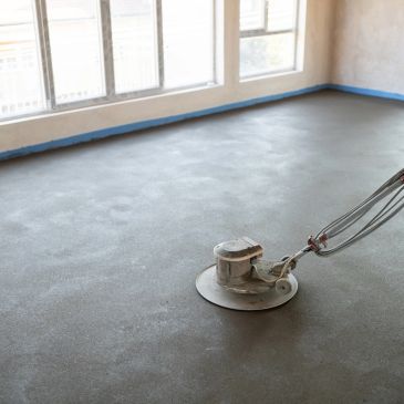Machine polishing a concrete floor.