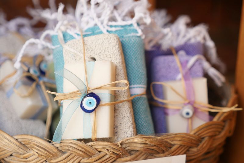 Beautifully arranged, handcrafted, and artisanal handmade soaps and towels inside a stylish basket