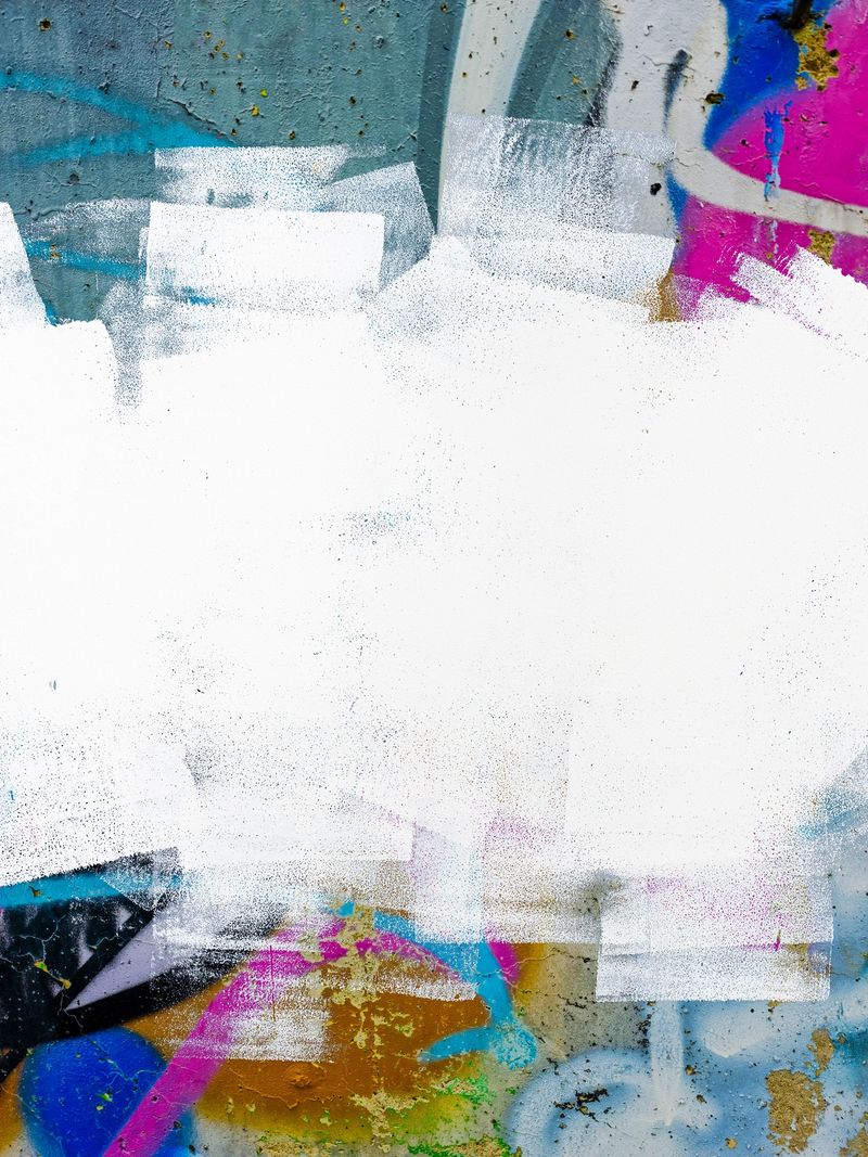 Urban street art elements, bold white brushstrokes, neon accents in pink, blue, yellow. 2000s, Y2K aesthetic, grunge texture. Digital art, modern web header, creative backgrounds.