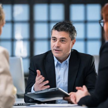 Business professionals reviewing plans