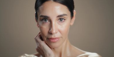 Close-up portrait of a woman with smooth skin.