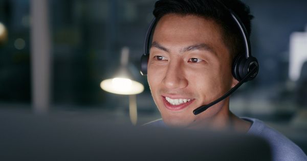 professional at work, likely providing service or support to others, even during non-traditional hours.