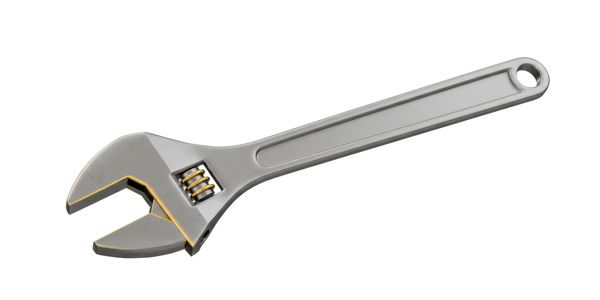 Adjustable wrench with gray handle and golden accents isolated on white.