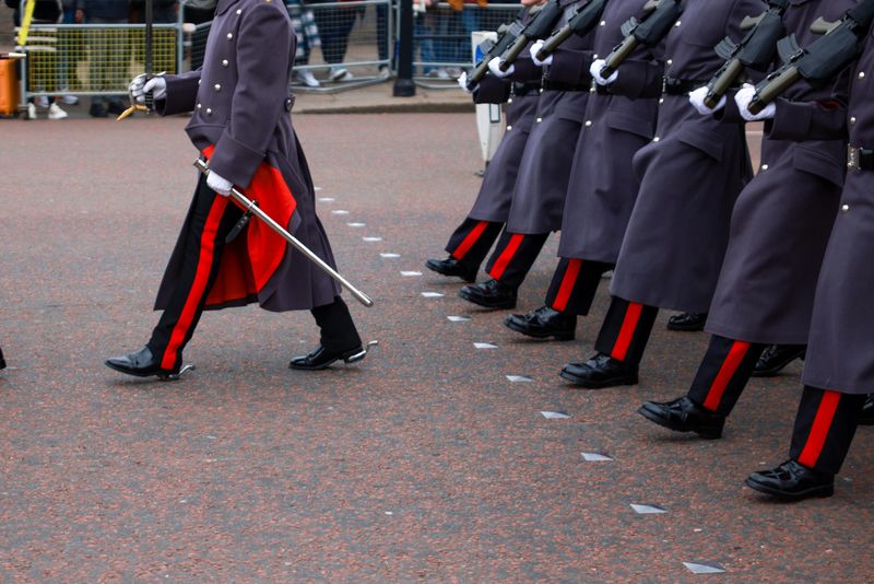 King's Guards march near Buckingham Palace in London, UK