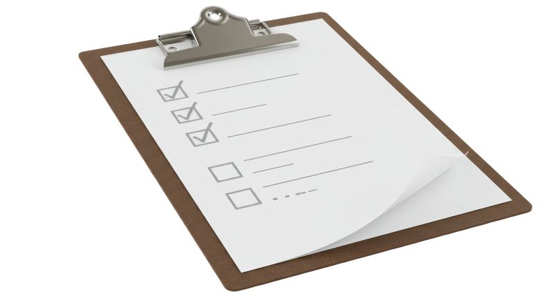 Isolated Clipboard with Checklist Boxes Ticked Off