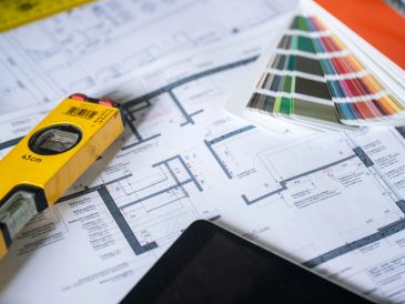 Architectural plans with measuring tape and color samples.