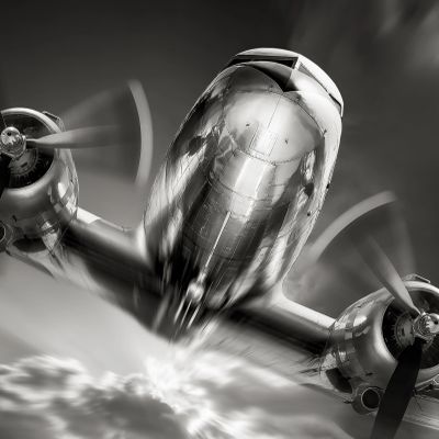 Vintage twin-engine airplane flying low.
