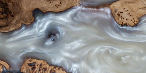 Swirling river with rocky banks.