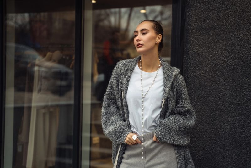 Stylish woman enjoying a weekday stroll in a bustling metropolitan area during the afternoon
