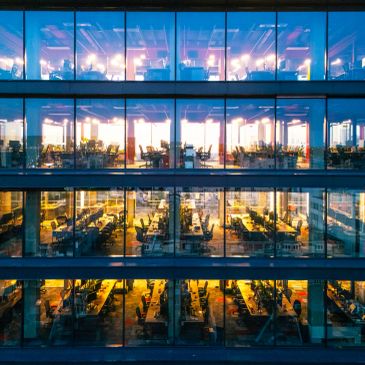 Office building viewed from outside during sunset.