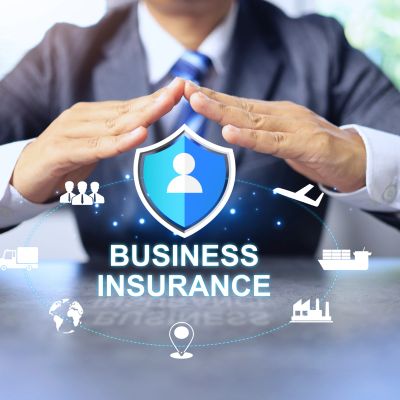 Business insurance protection concept with shield and icons.