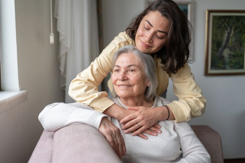 Daughter Hugging Senior Mother For Love Bonding Together