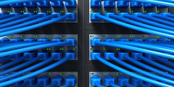 Blue network cables connected to a server panel.