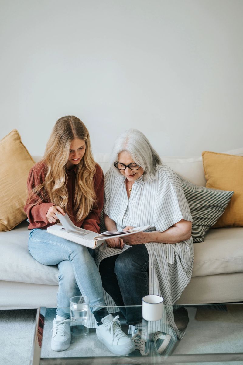 Mother and daughter looking at a family photo album