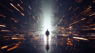 Silhouette of person walking into a glowing digital tunnel.