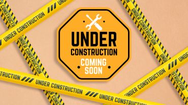 Yellow caution tape and sign indicate an upcoming construction project.